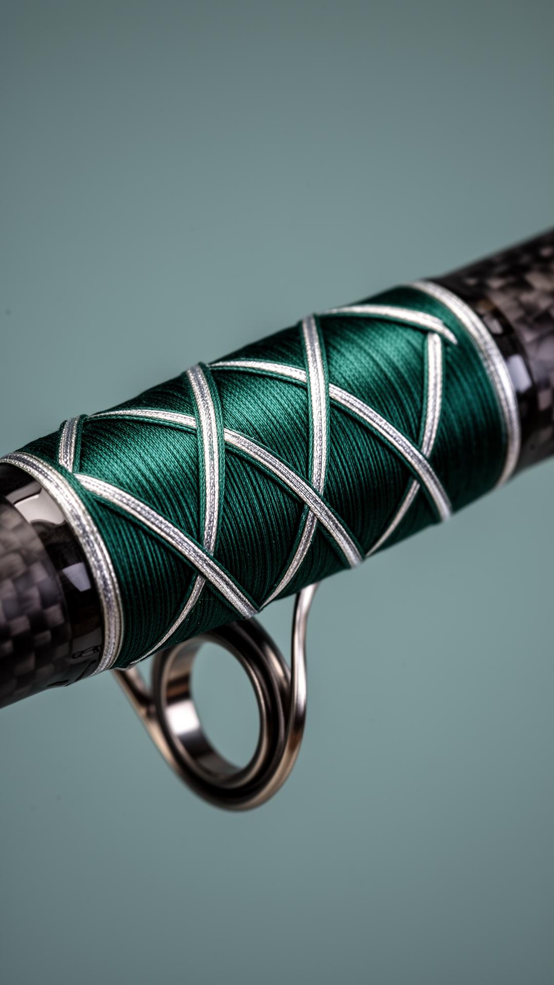 Detail of emerald and silver thread wrap on a custom rod